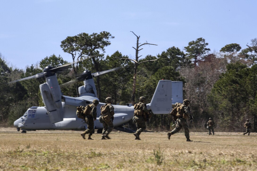 Marines offload from an MV-22B Osprey during a field exercise on Camp Lejeune, N.C., March 10, 2016. Marine Corps photo by Cpl. Paul S. Martinez