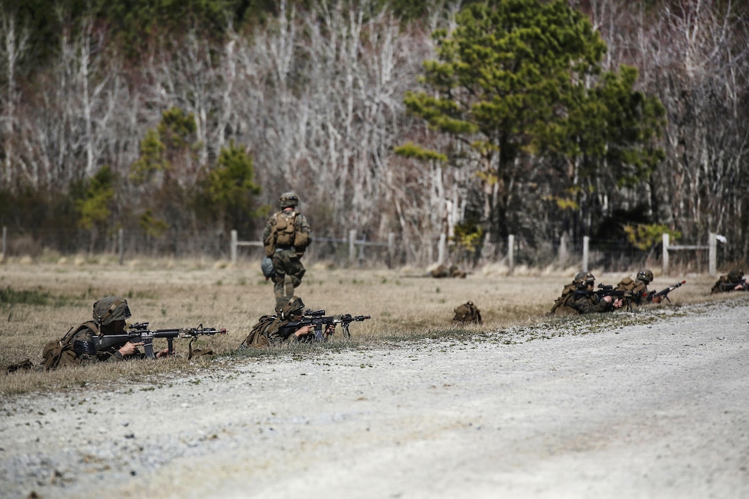 Marines set up a security perimeter after exiting an MV-22B Osprey during a field exercise on Camp Lejeune, N.C., March 10, 2016. Marine Corps photo by Cpl. Paul S. Martinez