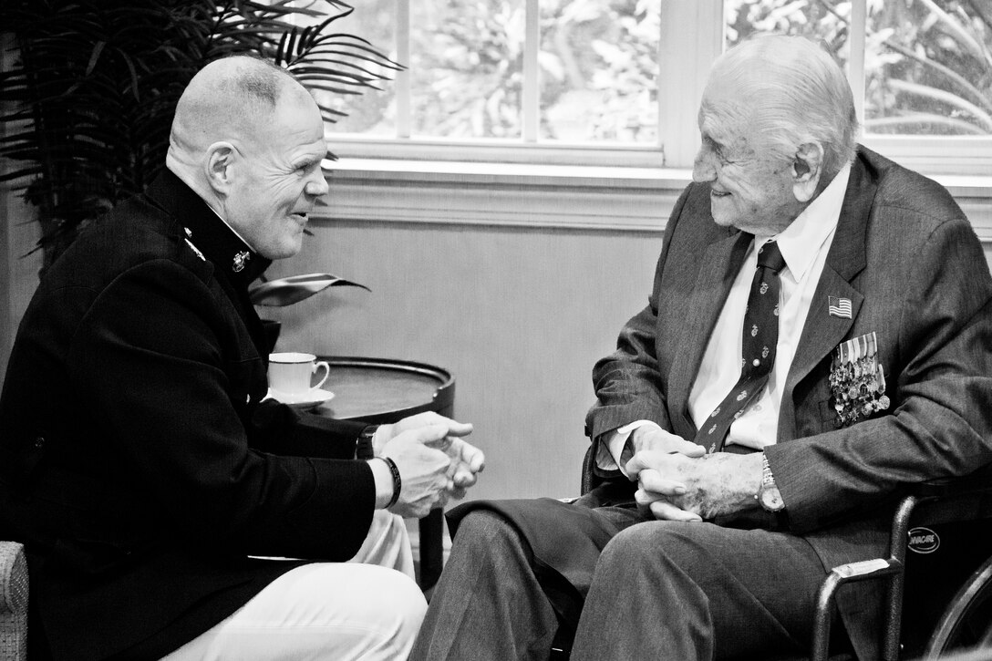Commandant of the Marine Corps Gen. Robert B. Neller, left, talks with retired U.S. Marine Lt. Gen. Lawrence F. Snowden, an Iwo Jima veteran, before his award ceremony at Tallahassee, Fla., March 18, 2016. Neller presented Snowden with the Department of Defense Medal for Distinguished Public Service and Navy Distinguished Public Service Award. (U.S. Marine Corps photo illustration by Staff Sgt. Gabriela Garcia/Released)