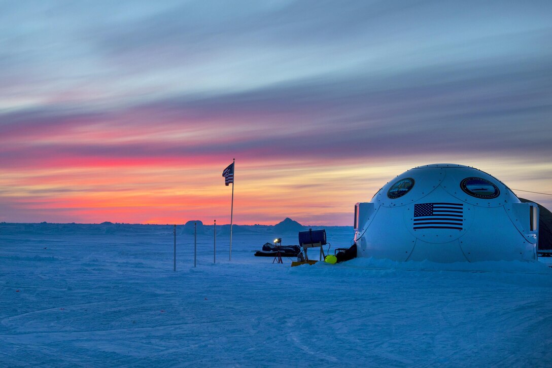 The sun sets on Ice Camp Sargo during Ice Exercise 2016 at the Arctic Circle, March 8, 2016. ICEX 2016 is a five-week exercise that allows the U.S. Navy to assess operational readiness in the Arctic, increase experience in the region, advance understanding of the Arctic environment, and develop partnerships and collaborative efforts. Navy photo by Petty Officer 2nd Class Tyler N. Thompson