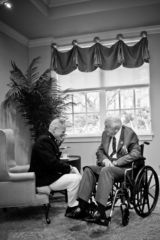 Commandant of the Marine Corps Gen. Robert B. Neller, left, talks with retired U.S. Marine Lt. Gen. Lawrence F. Snowden, an Iwo Jima veteran, before his award ceremony at Tallahassee, Fla., March 18, 2016. Neller presented Snowden with the Department of Defense Medal for Distinguished Public Service and Navy Distinguished Public Service Award. (U.S. Marine Corps photo illustration by Staff Sgt. Gabriela Garcia/Released)