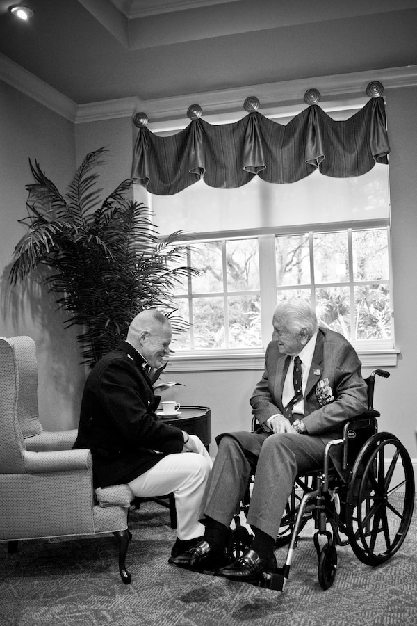 Commandant of the Marine Corps Gen. Robert B. Neller, left, talks with retired U.S. Marine Lt. Gen. Lawrence F. Snowden, an Iwo Jima veteran, before his award ceremony at Tallahassee, Fla., March 18, 2016. Neller presented Snowden with the Department of Defense Medal for Distinguished Public Service and Navy Distinguished Public Service Award. (U.S. Marine Corps photo illustration by Staff Sgt. Gabriela Garcia/Released)