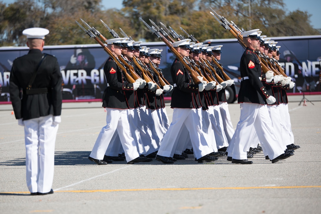 Col. Paul D. Cucinotta, Recruit Training Regiment commanding officer, observes the Silent Drill Platoon during the pass in review at Parris Island, S.C., Mar. 15, 2016. The platoon, assigned to the Battle Color Detachment based at Marine Barracks Washington, D.C., executed nearly 15 minutes of Precision drill movements without verbal commands in front of recruits, Marines and civilians. The performance was part of the detachment’s 2016 spring tour. (Photos by Pfc. Carlin Warren)
