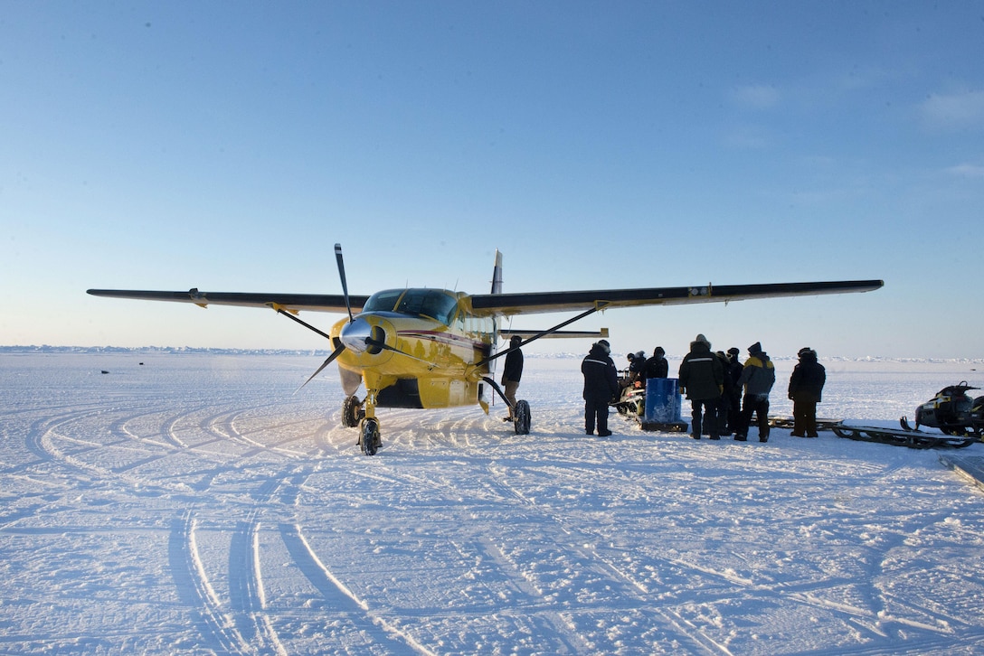 Sailors unload supplies from a Cessna Grand Caravan aircraft during Ice Exercise 2016 at Ice Camp Sargo, Arctic Circle, March 8, 2016. The sailors are assigned to the Arctic Submarine Laboratory. Navy photo by Petty Officer 2nd Class Tyler N. Thompson