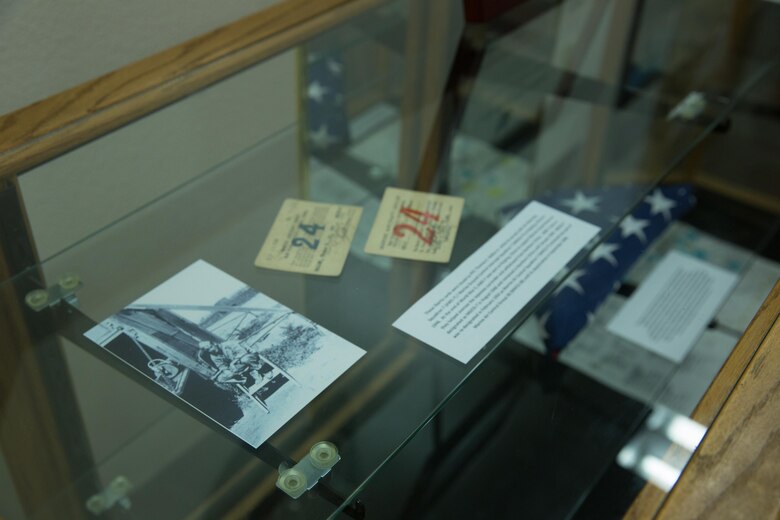 Photographs, official documents and other memorabilia rest in a display case Marine Air Control Group (MACG) 38’s heritage room aboard Marine Corps Air Station, Calif., March 16. Marines with MACG-38 hosted three surviving family members of Staff Sgt. Jacob Marty, the first Marine to be killed in action from Air Warning Squadron (AWS) 1, a unit that was affiliated with MACG-38. (U.S. Marine Corps photo by Sgt. Lillian Stephens/Released)