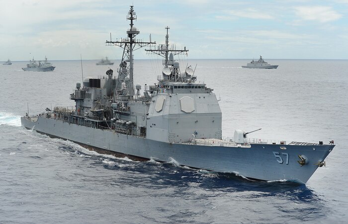 140725-N-FC670-226 PACIFIC OCEAN (July 25, 2014) The guided-missile cruiser USS Lake Champlain (CG 57) underway in close formation as one of forty-two ships and submarines representing 15 international partner nations during Rim of the Pacific (RIMPAC) 2014. Champlain is currently conducting live-fire testing off the coast of California with its 5-inch guns to verify the new mode on the SPQ-9B while the crew undergoes operator training to ensure proficiency with the new capability. (U.S. Navy photo by Mass Communication Specialist 1st Class Shannon Renfroe/Released)