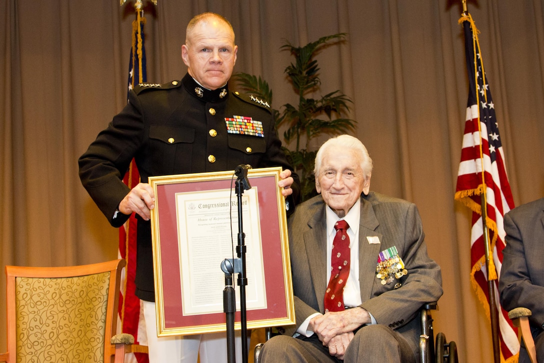 Commandant of the Marine Corps Gen. Robert B. Neller, left, poses for a photo with retired U.S. Marine Lt. Gen. Lawrence F. Snowden, an Iwo Jima veteran, at Tallahassee, Fla., March 18, 2016. Neller presented Snowden with the Department of Defense Medal for Distinguished Public Service and Navy Distinguished Public Service Award. (U.S. Marine Corps photo by Staff Sgt. Gabriela Garcia/Released)