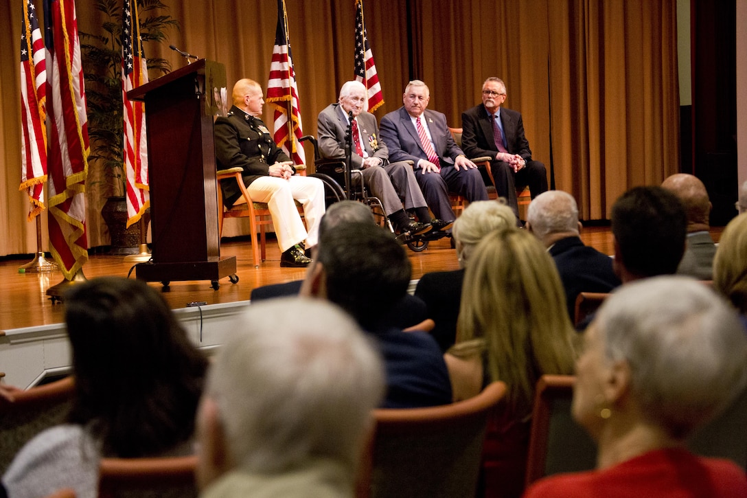 Retired U.S. Marine Lt. Gen. Lawrence F. Snowden, top center, an Iwo Jima veteran, speaks during his award ceremony at Tallahassee, Fla., March 18, 2016. Commandant of the Marine Corps Gen. Robert B. Neller presented Snowden with the Department of Defense Medal for Distinguished Public Service and Navy Distinguished Public Service Award. (U.S. Marine Corps photo by Staff Sgt. Gabriela Garcia/Released)