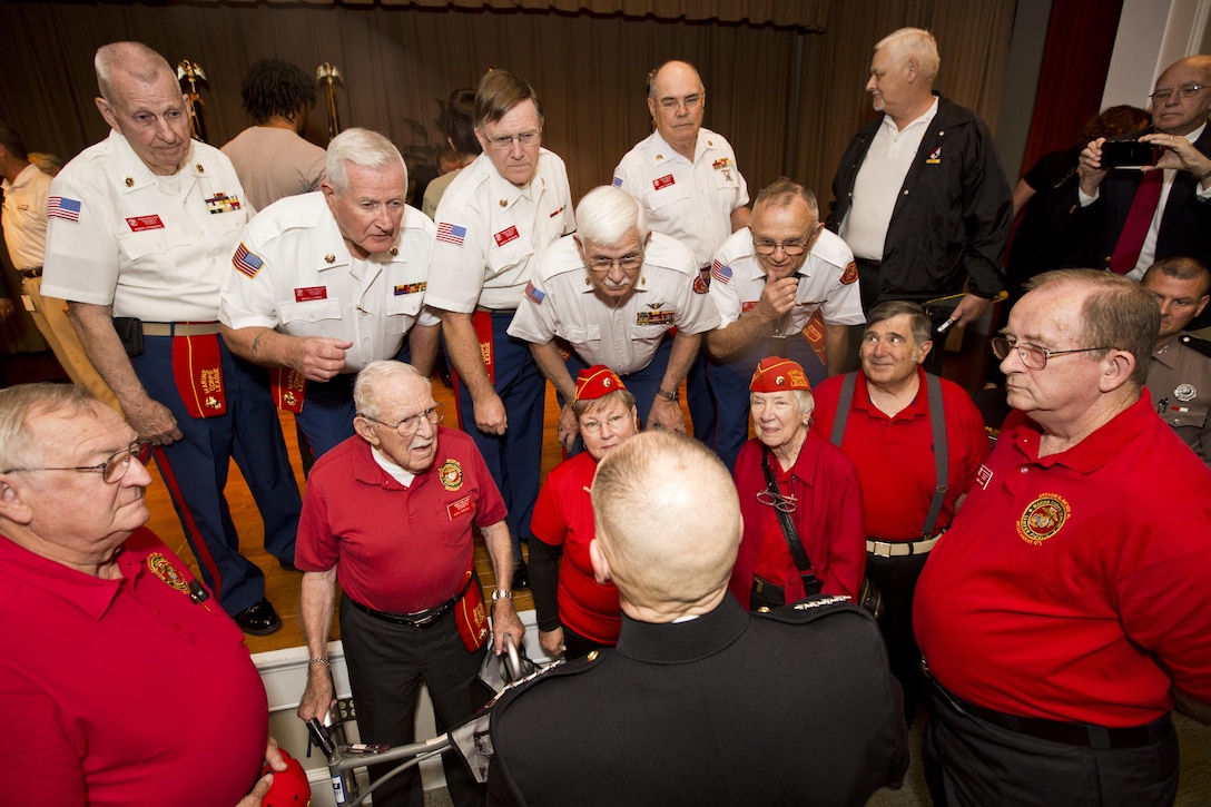 Commandant of the Marine Corps Gen. Robert B. Neller, bottom center, talks with members of the Marine Corps League after an award ceremony at Tallahassee, Fla., March 18, 2016. Neller presented retired U.S. Marine Lt. Gen. Lawrence F. Snowden, an Iwo Jima veteran, with the Department of Defense Medal for Distinguished Public Service and Navy Distinguished Public Service Award. (U.S. Marine Corps photo by Staff Sgt. Gabriela Garcia/Released)