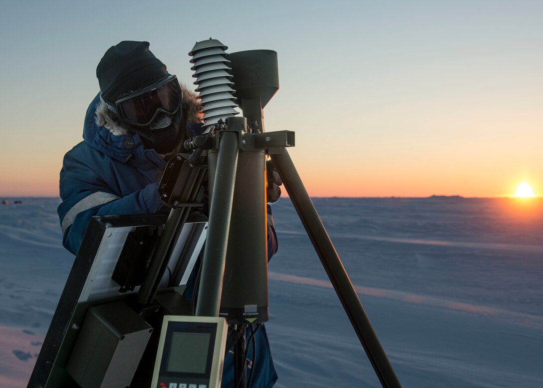 Navy Petty Officer 1st Class Daryl Meer sets up an Advanced Automated Weather Observation System during Ice Exercise 2016 at Ice Camp Sargo, Artcic Circle, March 10, 2016. Meer is an aerographer's mate assigned to the Fleet Weather Center Norfolk. Navy photo by Petty Officer 2nd Class Tyler N. Thompson
