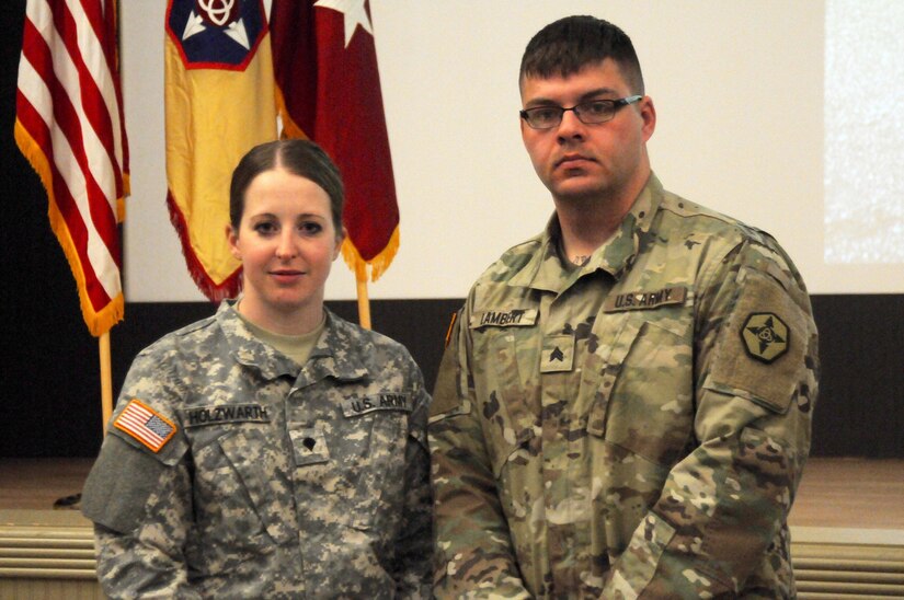 Spc. Christine Holzwarth of Billings, Mont., poses with her sponsor and was the sole female Soldier in the 364th ESC Best Warrior Competition held at JBLM March 2-5. Holzwath advanced from the 652nd Regional Support Group’s competition held earlier this year in Helena, Mont. The BWC shows that the Soldiers of 364th ESC are committed to the warrior ethos and stand ready, trained and able to defeat the enemies of the United States.