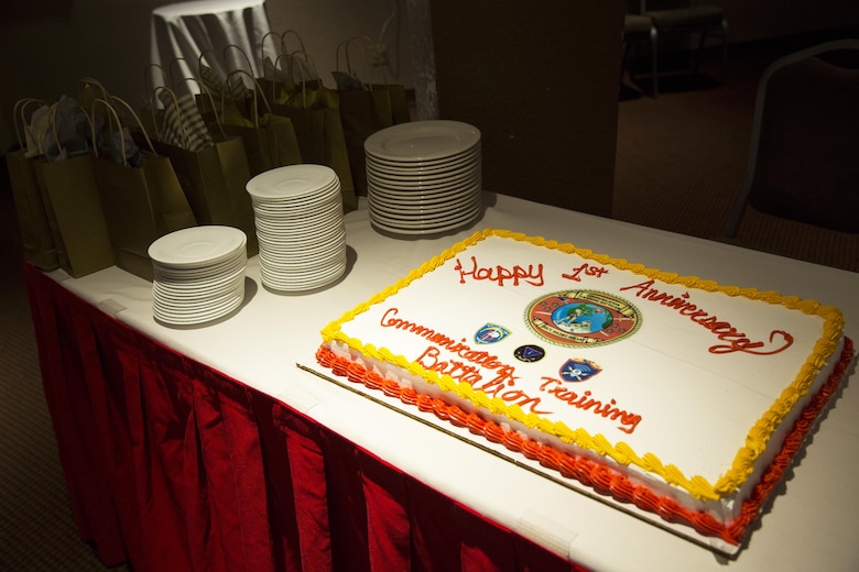 Communication Training Battalion, Marine Corps Communication-Electronics School, celebrates their first year with an anniversary cake at the Officer’s Club March 10, 2016. The battalion, activated March 12, 2015, brought the training of enlisted and commissioned communication Marines under one command. (Official Marine Corps photo by Lance Cpl. Levi Schultz/Released)