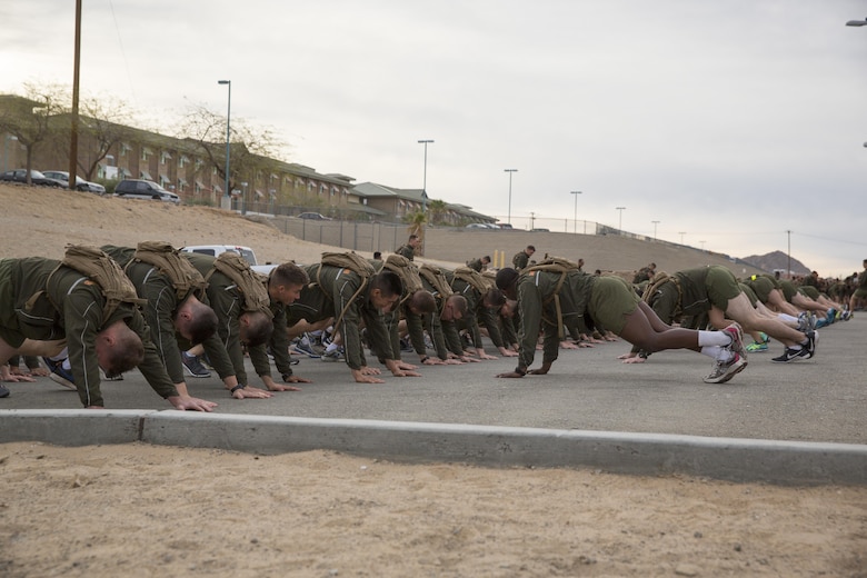 Marines with Communication Training Battalion, Marine Corps Communication-Electronics School, warm-up before participating in a three-mile motivational run in honor of the battalion’s anniversary aboard the Combat Center March 11, 2016. The battalion, activated March 12, 2015, brought the training of enlisted and commissioned communication Marines under one command. (Official Marine Corps photo by Lance Cpl. Levi Schultz/Released)