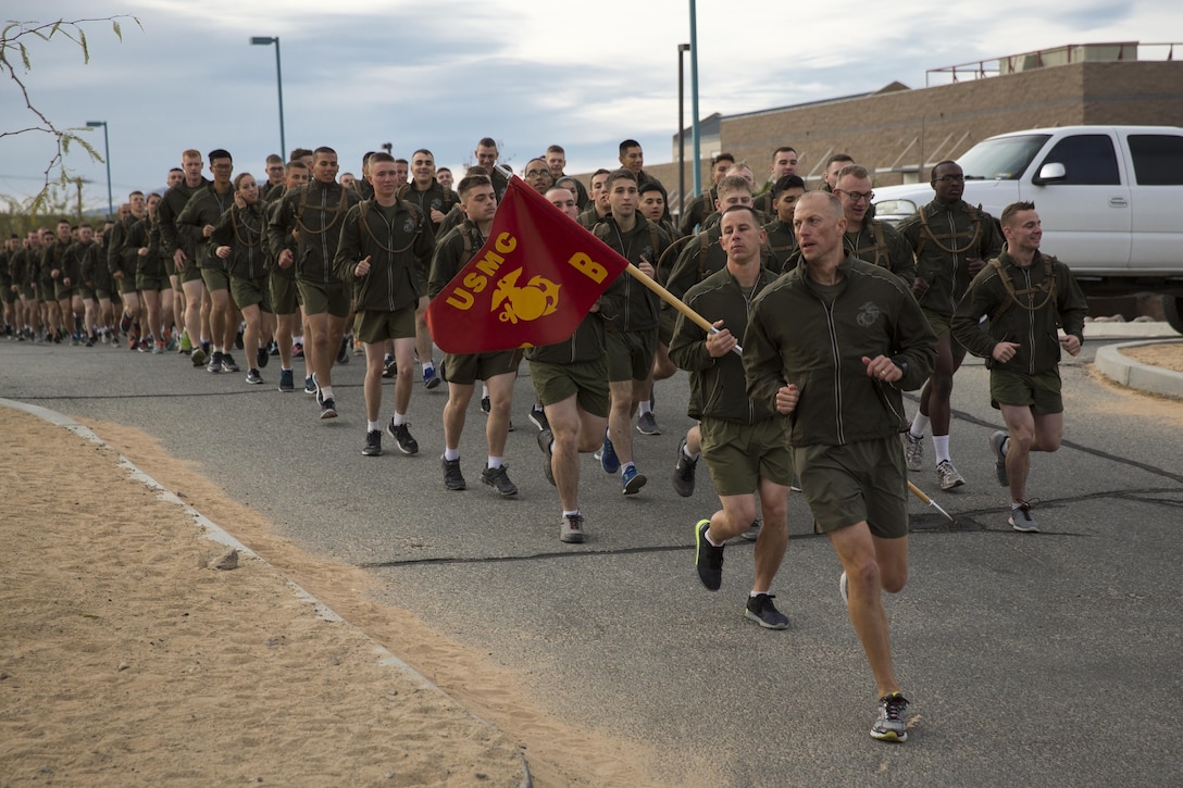 Company B, Communication Training Battalion, Marine Corps Communication-Electronics School, runs in formation during a three-mile motivational run in honor of the battalion anniversary aboard the Combat Center March 11, 2016. The battalion, activated March 12, 2015, brought the training of enlisted and commissioned communication Marines under one command. (Official Marine Corps photo by Lance Cpl. Levi Schultz/Released)