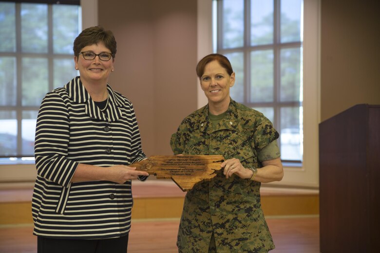 Nancy Brooks, vice president of procurement for Best Buy, receives a gift from Lt. Col. Mary Kate Flatley during a Lean In Circles event at Camp Lejeune, N.C., March 16, 2016. The event, which focused on networking and leadership, was open to Marines, sailors, and civilian personnel through II Marine Expeditionary Force, and was attended by Maj. Gen. Walter L. Miller, Jr., the II MEF commanding general. In Sept. 2015, Secretary of Defense Ash Carter announced a partnership with LeanIn.Org, founded by Facebook Chief Operating Officer Sheryl Sandberg, as a tool for mentorship. (U.S. Marine Corps photo by Cpl. Fatmeh Saad/ Released)