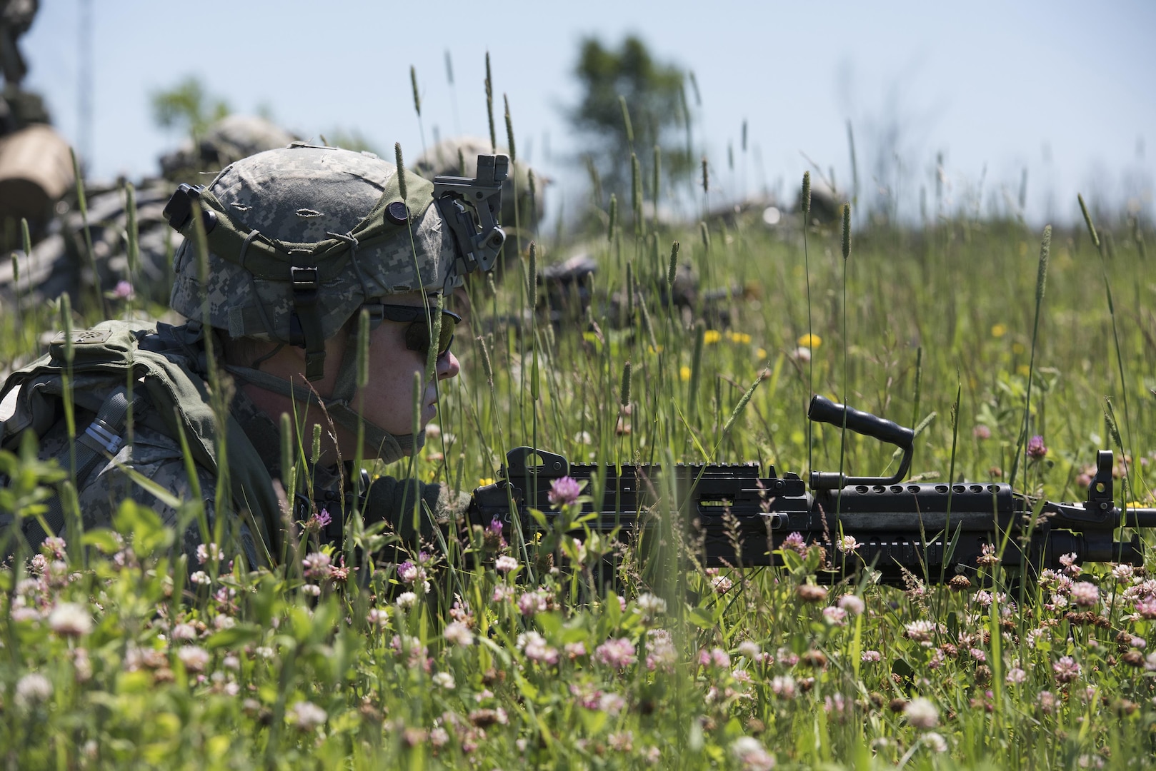 A U.S. Soldier with Alpha Company, 3rd Battalion, 172nd Infantry Regiment, 86th Infantry Brigade Combat Team (Mountain), Vermont Army National Guard, prepares to assault an objective during annual training at Fort Drum, New York, June 24, 2015. National Guard Airmen and Soldiers are involved in many components of America's warfight.