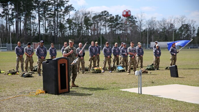 Lieutenant Col. Craig Wolfenbarger, commanding officer of 2nd Marine Raider Battalion, spoke at the conclusion of the Marine Raider Memorial March after he was presented the paddle that was recovered from the wreckage. The Marine Raider Memorial March was designed to honor the seven Marine Raiders who died on March 10, 2015 and their families, as well as bring awareness to their sacrifice. There was a short ceremony to honor the fallen at Stone Bay at Marine Corps Base Camp Lejeune, N.C., March 21, 2016.