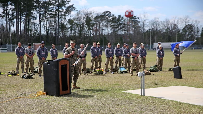 Lieutenant Col. Craig Wolfenbarger, commanding officer of 2nd Marine Raider Battalion, spoke at the conclusion of the Marine Raider Memorial March after he was presented the paddle that was recovered from the wreckage. The Marine Raider Memorial March was designed to honor the seven Marine Raiders who died on March 10, 2015 and their families, as well as bring awareness to their sacrifice. There was a short ceremony to honor the fallen at Stone Bay at Marine Corps Base Camp Lejeune, N.C., March 21, 2016.