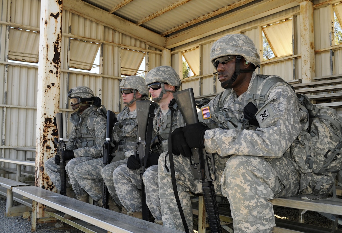 U.S. Army Reserve Soldiers wait to qualify on the rifle range during the 642nd Regional Support Group's Best Warrior Competition at Fort McClellan, Ala., Feb. 18. The brigade-level competition tests the Soldiers' military skills, knowledge and fitness. The 642nd RSG is based in Decatur, Ga. (U.S. Army photo by Sgt. 1st Class Gary A. Witte, 642nd Regional Support Group)