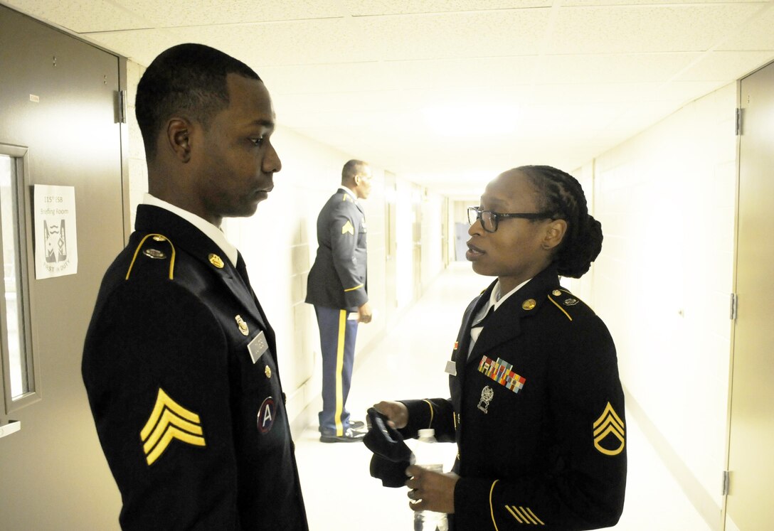 U.S. Army Sgt. Wayne Jones of Gainesville, Ga., a team leader with the 461st Human Resources Company, talks to his sponsor Staff Sgt. Makeisha L. Evans of Greenville, S.C., prior to a examination board for the 642nd Regional Support Group's Best Warrior Competition at Fort McClellan, Ala., Feb. 20. (U.S. Army photo by Sgt. 1st Class Gary A. Witte, 642nd Regional Support Group)