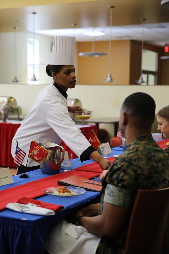 Sgt. Fatimah Butler presents her dish for the Chef of the Quarter Competition at the Marine Corps Air Station Cherry Point, N.C., mess hall, March 17, 2016. Three Marines competed this quarter, and Butler was named the winner. Butler will move on to the Chef of the Year Competition and compete with the other Chef of the Quarter winners. (U.S. Marine Corps photo by Lance Cpl. Mackenzie Gibson/Released)