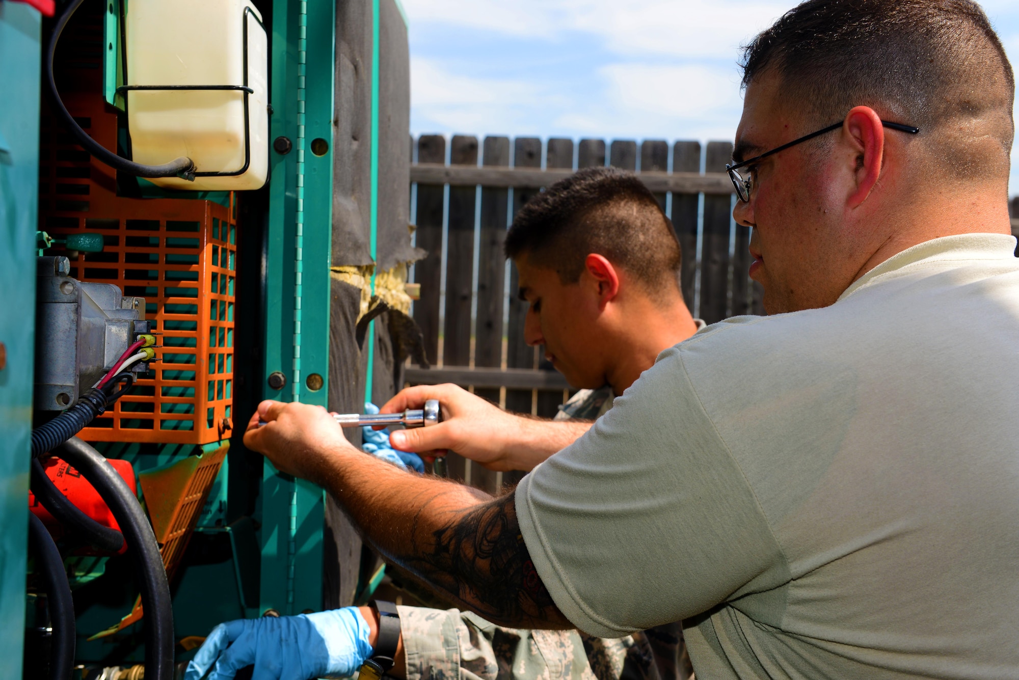 Airman 1st Class Jesus Izaguirre, left, and Senior Airman Zachary Shaver, 2nd Civil Engineer Squadron power production Airmen, perform maintenance on a generator at Barksdale Air Force Base, La., March 15, 2016. The generator received new oil, new coolant and a new air filter and was tested to ensure it was running properly. (U.S. Air Force photo/Airman 1st Class Luke Hill)