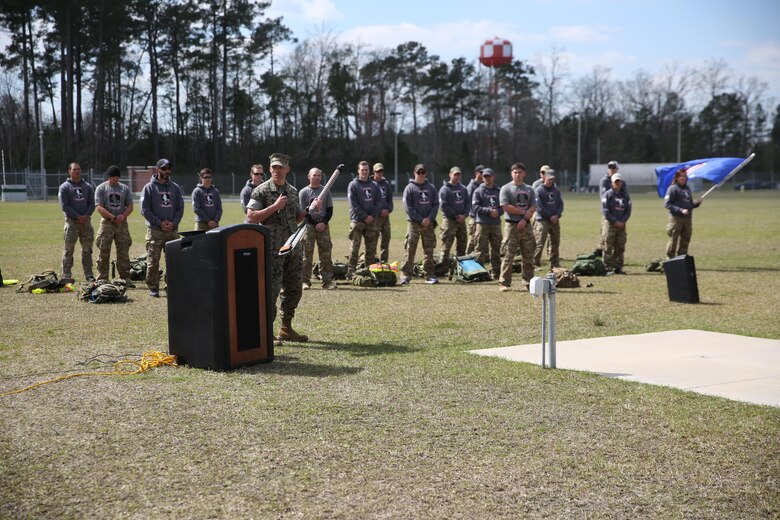 Lieutenant Col. Craig Wolfenbarger, commanding officer of 2nd Marine Raider Battalion, spoke at the conclusion of the Marine Raider Memorial March after he was presented the paddle that was recovered from the wreckage. The Marine Raider Memorial March was designed to honor the seven Marine Raiders who died on March 10th, 2015 and their families, as well as bring awareness to their sacrifice. There was a short ceremony to honor the fallen at Stone Bay aboard Marine Corps Base Camp Lejeune, N.C., March 21, 2016. 