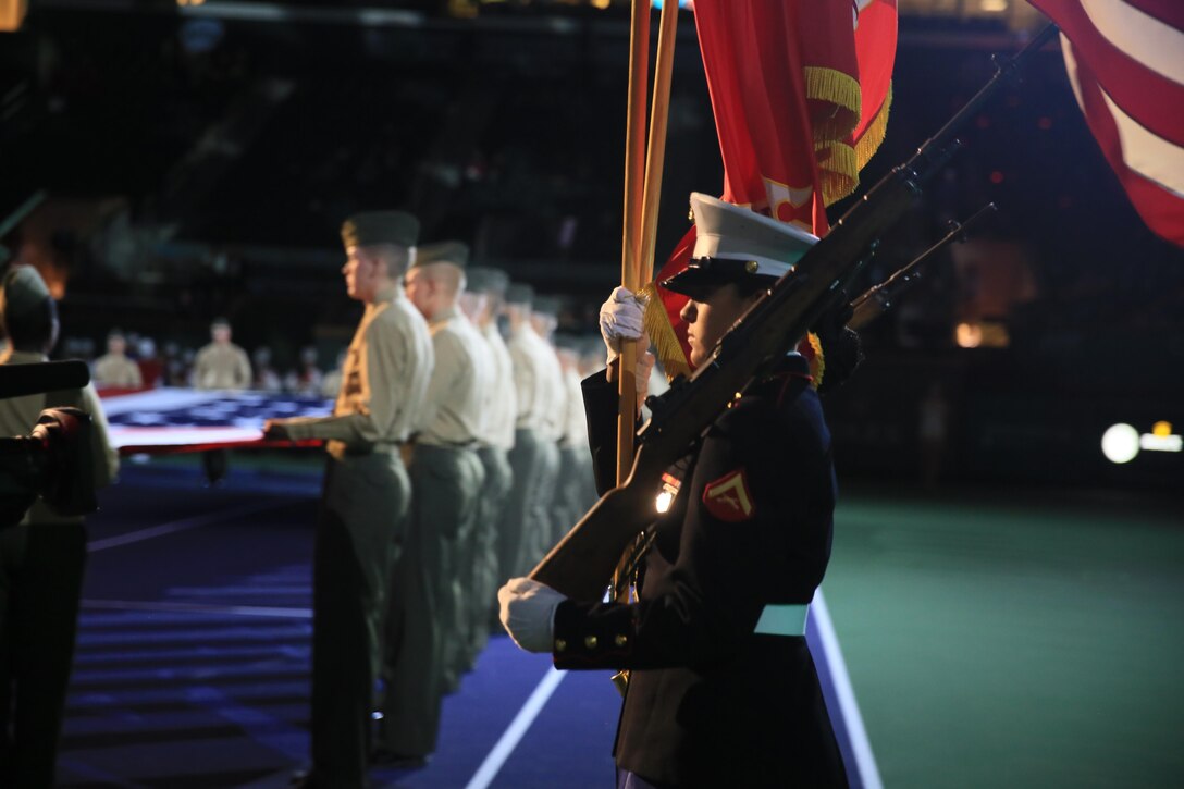 The Combat Center Color Guard marches onto the tennis court during the 14th annual Banque Nationale de Paris Paribas Open’s Salute to Heroes at the Indian Wells Tennis Garden in Indian Wells, Calif., March 11, 2016. (Official Marine Corps photo by Cpl. Julio McGraw/Released)