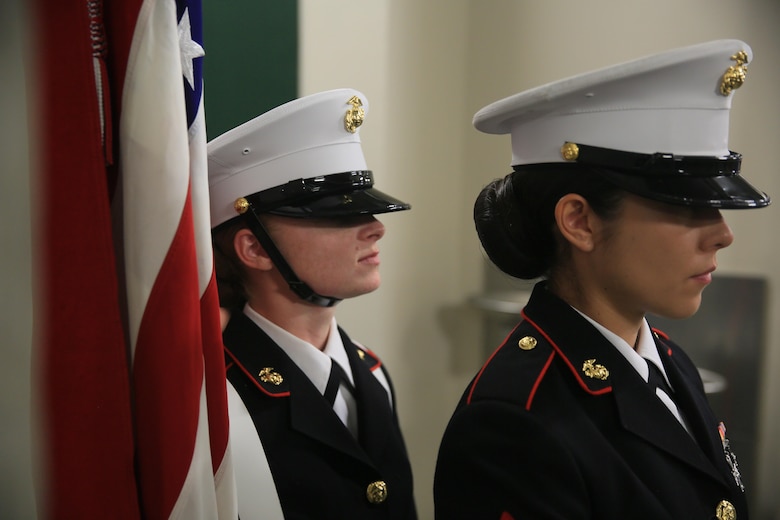 Sergeant Heather Keasler, Color Sergeant, and Cpl. Crystal Guerrero, rifle bearer, Combat Center Color Guard, prepare to march onto the court during the 14th annual Banque Nationale de Paris Paribas Open’s Salute to Heroes at the Indian Wells Tennis Garden in Indian Wells, Calif., March 11, 2016. (Official Marine Corps photo by Cpl. Julio McGraw/Released)