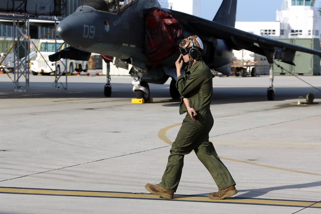 Lance Cpl. Devyn Wildcat directs an TAV-8B Harrier pilot prior to take off at Marine Corps Air Station Cherry Point, N.C., March 11, 2016. A plane captain is responsible for conducting a final examination of the aircraft and guiding the pilots out onto the runway. Plane captains possess extensive knowledge of their designated aircraft and can determine if there are any last minute discrepancies that could potentially ground the aircraft. Wildcat is a plane captain and a fixed-wing aircraft mechanic with Marine Attack Training Squadron 203. (U.S. Marine Corps photo by Cpl. N.W. Huertas/ Released)
