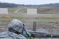 Paperwork - An Army Reserve Soldier with the 478th Engineer Battalion, zeroes his weapon on a paper target during the 478th Engineer Battalion's crew-served weapons qualification and field training exercise, March 10 to 13 at Fort Knox, Ky. (U.S. Army photo by Staff Sgt. Debralee Best)