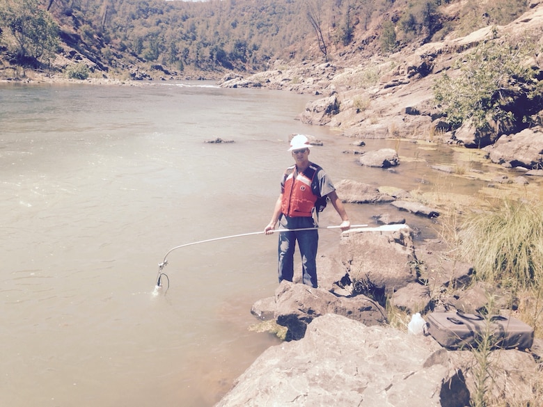 Jonathan Whipple, environmental chemist for the Sacramento District, conducts turbidity testing at the Yuba River Salmon Habitat Restoration Project at Englebright Lake, California, in the summer of 2015 during his rotation in the Recent Graduate Program with the Environmental Chemistry section. The Recent Graduates Program provides professional career development assignments to DA Interns by rotating them through different areas of work within the agency and gives them formal training opportunities at some of the Corps’ most respected educational centers. (U.S. Army photo by Carlos Acu / Released)