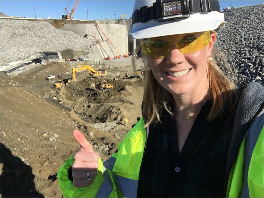 Spenser Ruvalcaba, civil engineer for the Sacramento District, gives a thumbs up from the approach channel of the Folsom Dam auxiliary spillway. Ruvalcaba and other Engineering and Construction employees must work at an on-site project office because around-the-clock construction activities require constant oversight. In the Recent Graduates Program, she was given professional career development assignments during her time as a DA Intern by rotating through different areas of work within the agency. (U.S. Army photo / Released)