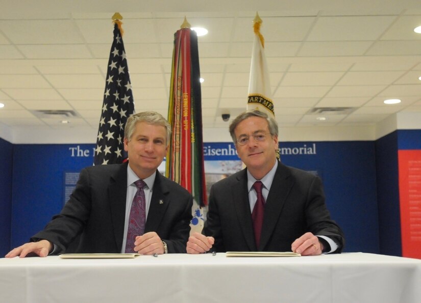 Stephen Austin, assistant chief of Army Reserve, and Sidney Goodfriend, founder and chairman of American Corporate Partners, take a moment to smile after signing a partnership agreement between the USAR and "ACP" during the American Corporate Partners and USAR Partnership Signing at the Pentagon in Washington March 21.