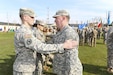 Military Intelligence Soldiers place new unit patches on one another during the activation ceremony of 207th Military Intelligence Brigade March 16, 2016 here at Hoekstra Field at Caserma Ederle. The 207th MI Bde. will serve as the Theater Intelligence Brigade for U.S. Africa Command and is under operational control of U.S. Army Africa. The brigade includes the 207th MI Bde. Headquarters and 307th MI Battalion located here, as well as the 522nd MI Battalion located at Wiesbaden, Germany, and the 337th MI Battalion located at Fort Sheridan, Ill. (U.S. Army Africa photo by Staff Sgt. Lance Pounds)