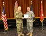 Maj. Gen. Ricky Waddell, commanding general of the 76th Operational Readiness Command, presented an award to Col. Anthony Demolina, during a retirement ceremony held at Fort Douglas, Utah, March 13.