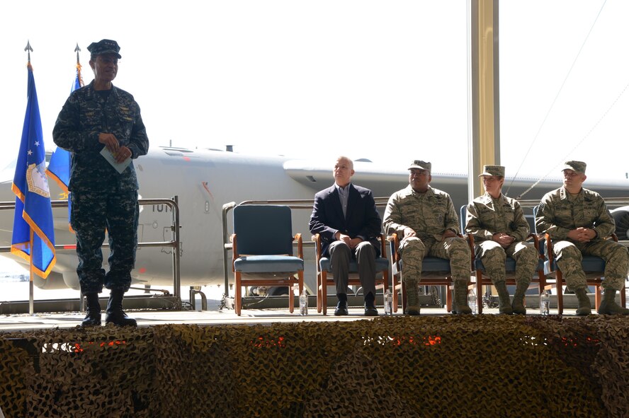 U.S. Navy Adm. Cecil D. Haney, U.S. Strategic Command (USSTRATCOM) commander (left), provides remarks during an award ceremony honoring the 2nd Bomb Wing at Barksdale Air Force Base, La., March 21, 2016. During the ceremony, Haney and Mr. W. Gary Gates (seated left), Strategic Command Consultation (SCC) Committee member, presented the 2015 Omaha Trophy, strategic bomber category, to U.S. Air Force Col. Kristin Goodwin, 2nd Bomb Wing commander (second from right), and U.S. Air Force Chief Master Sgt. Tommy Mazzone, 2nd Bomb Wing command chief master sergeant (right), in recognition of the wing's contributions to USSTRATCOM's global strategic missions. Also pictured, third from right, is U.S. Air Force Maj. Gen. Richard M. Clark, USSTRATCOM's Joint Functional Component Command for Global Strike commander. The Omaha Trophy, which dates back to the U.S. Air Force's Strategic Air Command, was originally created by the SCC in 1971. At the time, a single trophy was presented annually as a token of appreciation to USSTRATCOM's best wing. Since then, the tradition has evolved to unit-level awards that recognize the command's premier intercontinental ballistic missile (ICBM) wing, ballistic missile submarine, strategic bomber wing and global operations (space/cyberspace) unit. This year, a new category was added to include the combatant command's top strategic aircraft wing. (U.S. Air Force photo by Staff Sgt. Joseph A. Pagan Jr.)