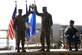 U.S. Air Force Col. Kristin Goodwin, 2nd Bomb Wing commander (left), and U.S. Air Force Chief Master Sgt. Tommy Mazzone, 2nd Bomb Wing command chief master sergeant (center), hold up the Omaha Trophy during an award ceremony honoring the 2nd Bomb Wing at Barksdale Air Force Base, La., March 21, 2016. During the ceremony, U.S. Navy Adm. Cecil D. Haney, U.S. Strategic Command (USSTRATCOM) commander (right), and Mr. W. Gary Gates (not pictured), Strategic Command Consultation (SCC) Committee member, presented the 2015 Omaha Trophy, strategic bomber category, to Goodwin and Mazzone in recognition of the wing's contributions to USSTRATCOM's global strategic missions. The Omaha Trophy, which dates back to the U.S. Air Force's Strategic Air Command, was originally created by the SCC in 1971. At the time, a single trophy was presented annually as a token of appreciation to USSTRATCOM's best wing. Since then, the tradition has evolved to unit-level awards that recognize the command's premier intercontinental ballistic missile (ICBM) wing, ballistic missile submarine, strategic bomber wing and global operations (space/cyberspace) unit. This year, a new category was added to include the combatant command's top strategic aircraft wing. (U.S. Air Force photo by Staff Sgt. Joseph A. Pagan Jr.)