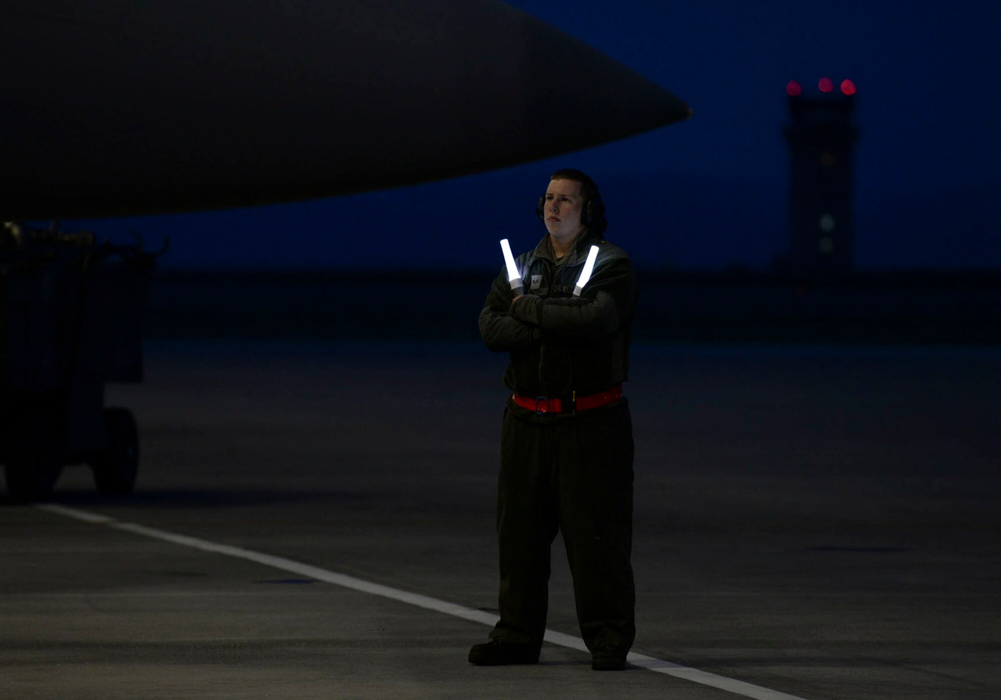 A crewchief waits to marshal an aircraft at Mountain Home Air Force Base, Idaho, March 15, 2016. The 366th Operations Group and 366th Maintenance Group conducted 24-hour operations during a 72-hour sortie surge. (U.S. Air Force photo by Airman 1st Class Jessica H. Evans/RELEASED)