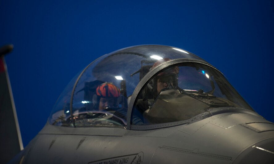 A pilot and weapons systems officer prepare for take-off as part of a 72-hour sortie surge March 15, 2016, at Mountain Home Air Force Base, Idaho. Airmen from the 366 Operations Group and the 366th Maintenance Group conducted 24-hour operations during the exercise. (U.S. Air Force photo by Senior Airman Malissa Lott/ RELEASED)