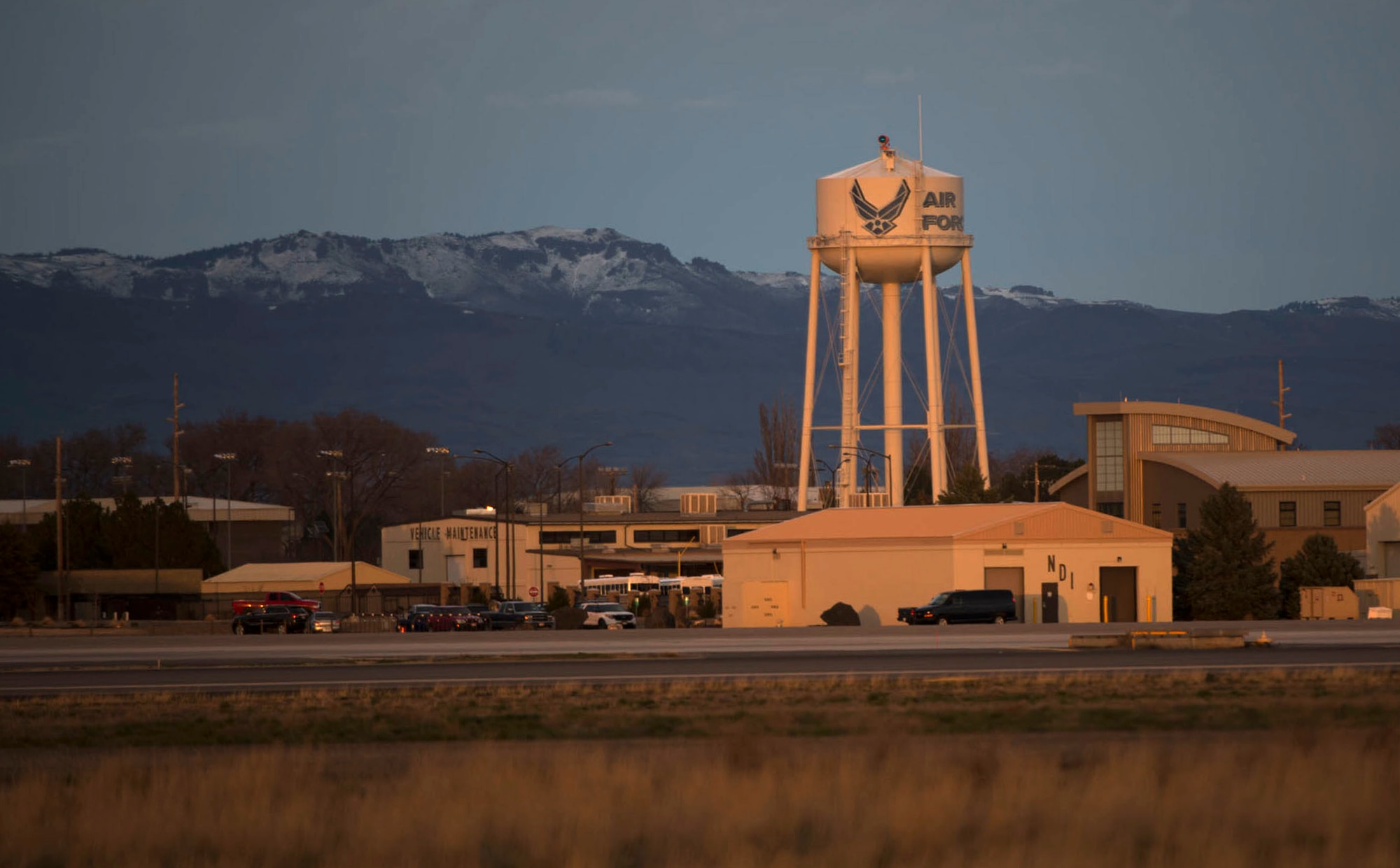 The last rays of sunlight stretch over the water tower at Mountain Home Air Force Base, Idaho, March 16, 2016.  The 366th Fighter Wing took part in a Sortie Surge March 14-17. In French, the word sortie means "a going out" from a Latin root, "surgere," or "rise up." Aircrews use the term to describe any time an aircraft takes off and then lands. (U.S. Air Force photo by Airman 1st Class Chester Mientkiewicz/Released)
