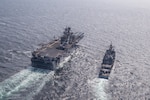 160316-N-TH560-384 EAST SEA (March 16, 2016) Forward-deployed amphibious assault ship USS Bonhomme Richard (LHD 6) conducts fueling operations with guided-missile cruiser USS Shiloh (CG 67).  Bonhomme Richard is the flagship of the Bonhomme Richard Expeditionary Strike Group and is participating in Exercise Ssang Yong 2016. SY16 is a biennial combined amphibious exercise conducted by forward-deployed forces with the Republic of Korea Navy and Marine Corps, Australian Army and Royal New Zealand Army Forces in order to strengthen interoperability and working relationships across a wide range of military operations from disaster relief to complex expeditionary operations.  (U.S. Navy photo by Mass Communication Specialist 3rd Class Jeanette Mullinax/Released)