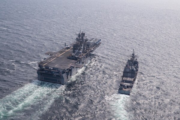 160316-N-TH560-384 EAST SEA (March 16, 2016) Forward-deployed amphibious assault ship USS Bonhomme Richard (LHD 6) conducts fueling operations with guided-missile cruiser USS Shiloh (CG 67).  Bonhomme Richard is the flagship of the Bonhomme Richard Expeditionary Strike Group and is participating in Exercise Ssang Yong 2016. SY16 is a biennial combined amphibious exercise conducted by forward-deployed forces with the Republic of Korea Navy and Marine Corps, Australian Army and Royal New Zealand Army Forces in order to strengthen interoperability and working relationships across a wide range of military operations from disaster relief to complex expeditionary operations.  (U.S. Navy photo by Mass Communication Specialist 3rd Class Jeanette Mullinax/Released)