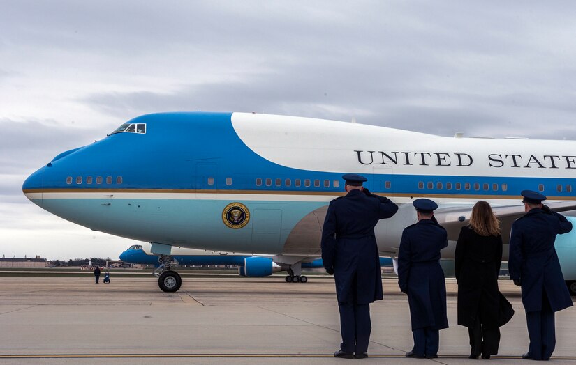 Col. Christopher Thompson, the 89th Airlift Wing vice commander, and 89th AW Airmen salute as Air Force One departs Joint Base Andrews, Md., March 20, 2016. President Barack Obama and the first family are on a two-day visit to Cuba, making history as the first U.S. president to visit Cuba in nearly 90 years. (U.S. Air Force photo/Senior Master Sgt. Kevin Wallace)
