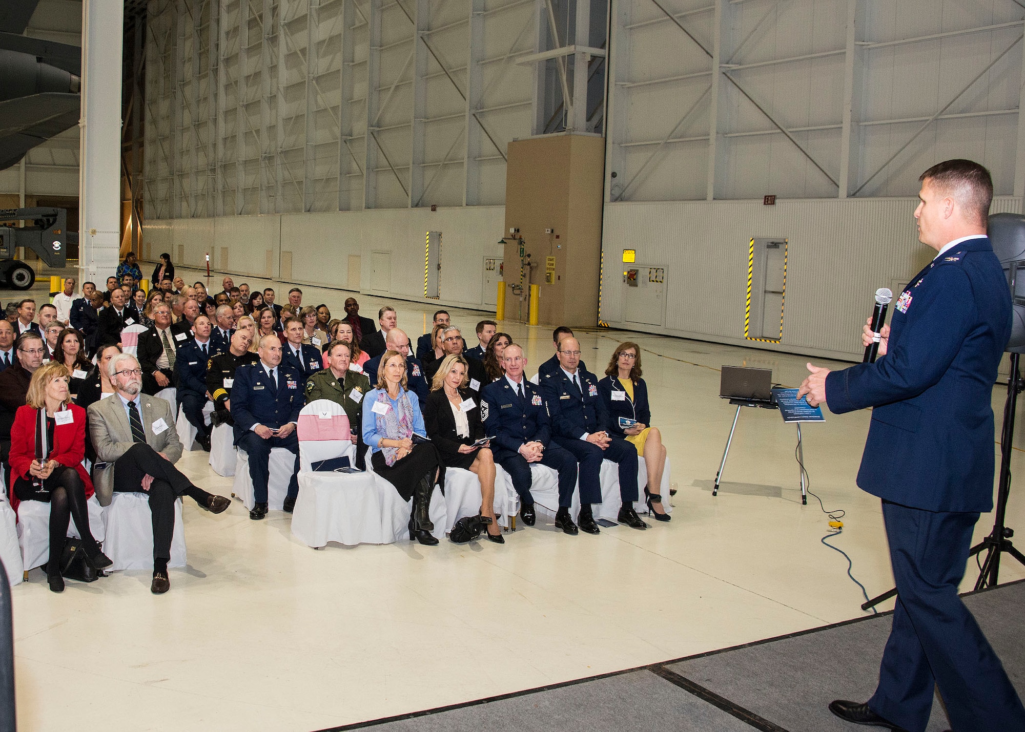 Col. Corwin Pauly, 60th Air Mobility Wing vice commander, speaks March 10, 2016, at the honorary commanders induction ceremony at Travis Air Force Base, California. The base elected 35 honorary commanders to serve at the wing, group, and squadron levels in 2016. (U.S. Air Force photo by T.C. Perkins Jr.)