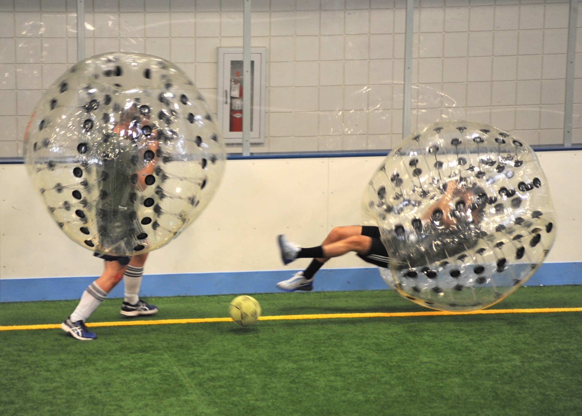 Airmen from the 319th Air Base Wing compete in a knocker ball tournament March 18, 2016, on Grand Forks Air Force Base, N.D. Airmen wore a plastic bubble and played soccer, but were able to knock each other off their feet. (U.S. Air Force photo by Airman 1st Class Patrick Wyatt/Released)