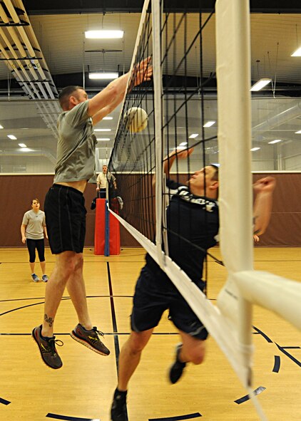 Staff Sgt. Christopher Ford, 319th Operations Support Squadron weather flight NCO-in-charge, blocks a volleyball during the 2016 Winter Bash March 18, 2016, on Grand Forks Air Force Base, N.D. Airmen from the 319th Air Base Wing competed in several events to be named the Winter Bash Champions. (U.S. Air Force photo by Airman 1st Class Ryan Sparks/Released)