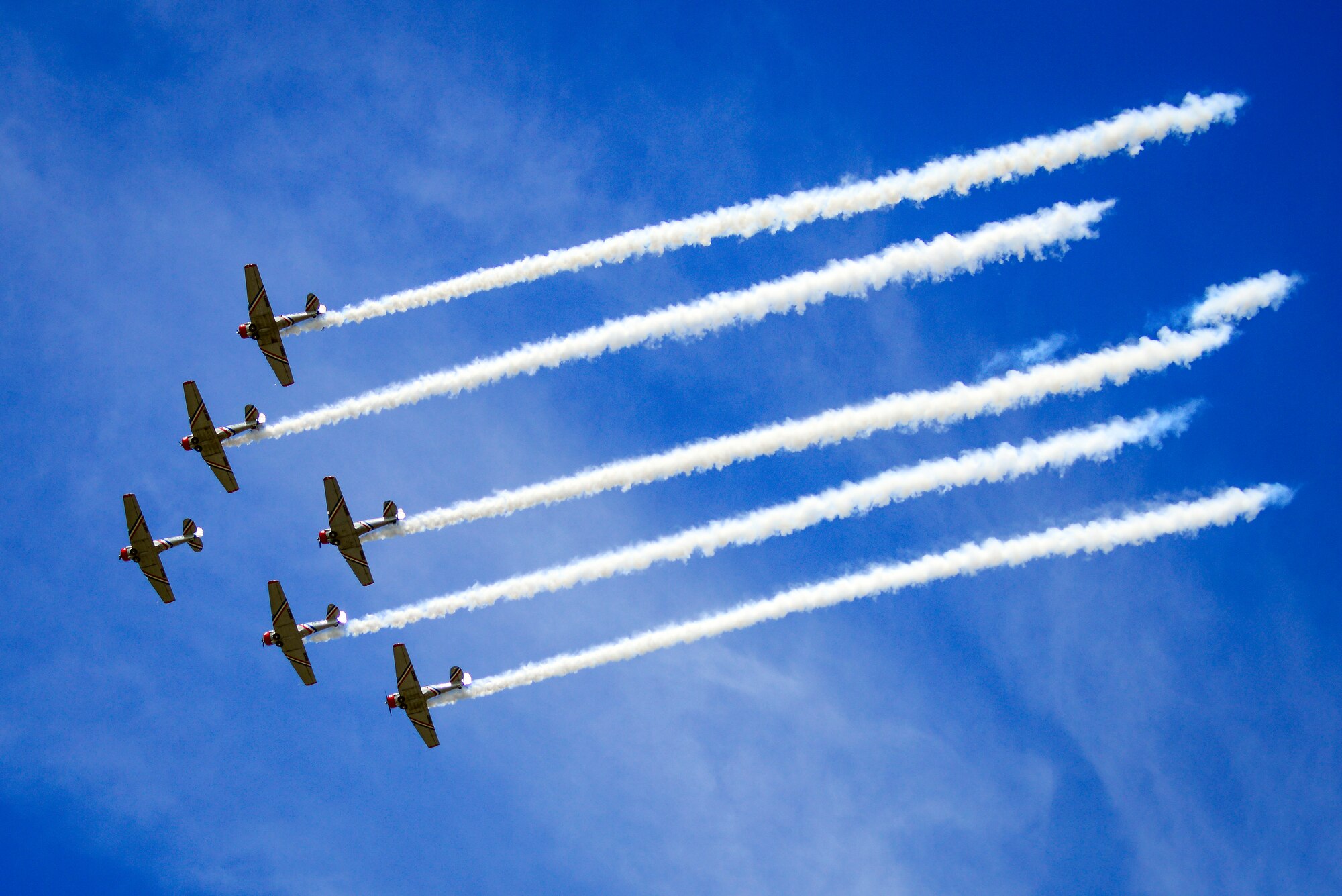 The Geico Skytypers Air Show Team flies in formation at the start of their performance during  Tampa Bay AirFest 2016 at MacDill Air Force Base, Fla., March 20, 2016. The diverse flying expertise of the team members aligns perfectly with the unique components of their overall performance. (U.S. Air Force photo by Staff Sgt. Melanie Hutto)