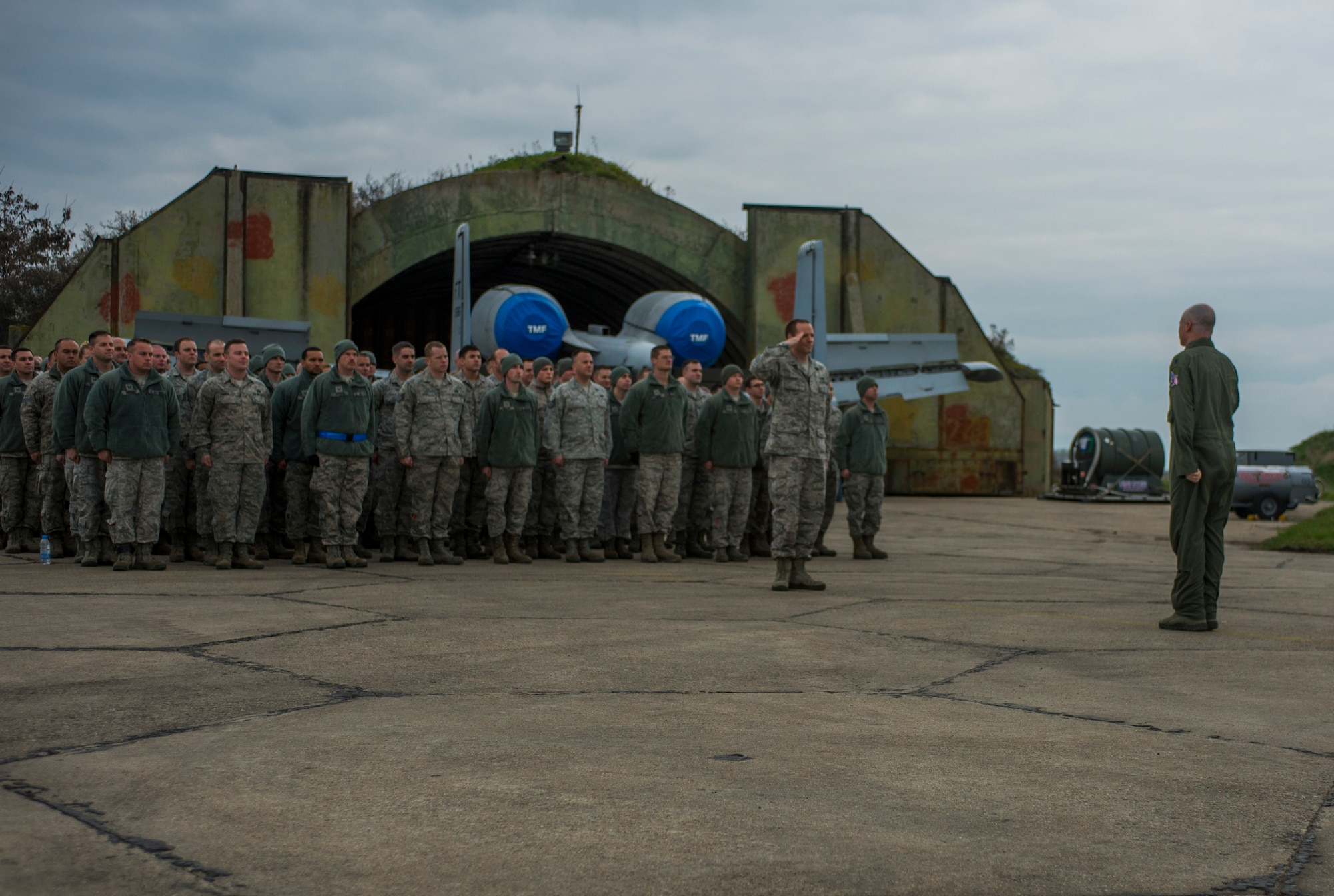U.S. Air Force Lt. Col. Bryan France, 74th Expeditionary Fighter Squadron commander, right, salutes U.S. Air Force 1st Lt. Jason Story, 74th EFS maintenance officer, before addressing a flight of maintenance Airmen during the 74th EFS’s deployment in support of Operation Atlantic Resolve at Graf Ignatievo, Bulgaria, March 16, 2016. France touted the maintainers’ ability to generate thousands of sorties during their six-month deployment throughout countries in Eastern Europe. (U.S. Air Force photo by Staff Sgt. Joe W. McFadden/Released)