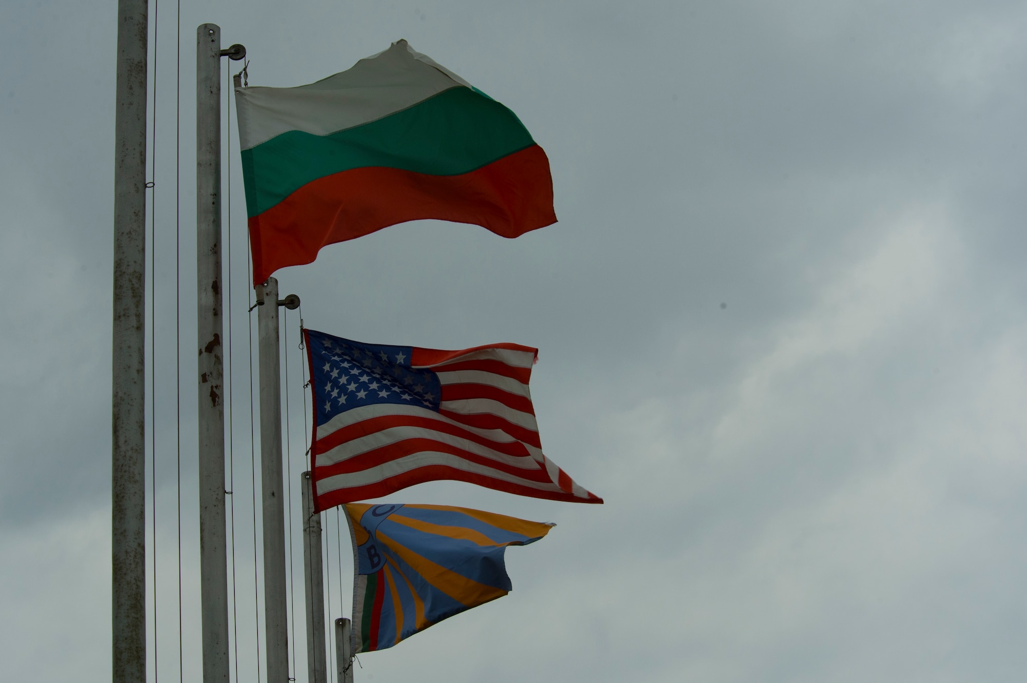 The Bulgarian and United States flags wave on flagpoles outside the Bulgarian air force 3rd Air Force Base headquarters at Graf Ignatievo, Bulgaria, March 16, 2016. The Bulgarians hosted the U.S. Air Force’s 74th Expeditionary Fighter Squadron which completed a six-month deployment to Eastern Europe March 18, 2016, in support of Operation Atlantic Resolve. (U.S. Air Force photo by Staff Sgt. Joe W. McFadden/Released)